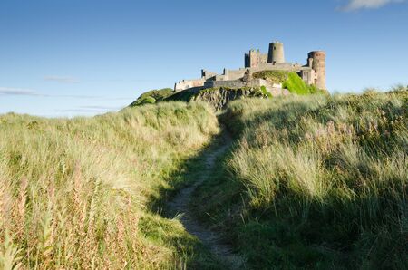Path to Bamburgh Castle taken here from the north beach path dates back to the 6 7th centuryのeditorial素材