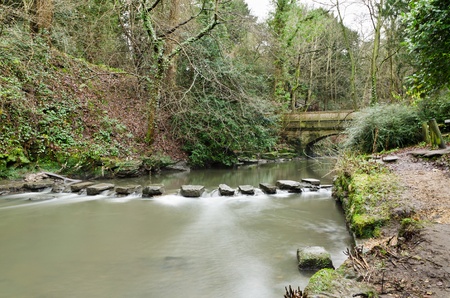 Jesmond Dene stepping stones are in a deep post-glacial valley providing a quiet haven just one mile from Newcastle Upon Tyne city centreの写真素材