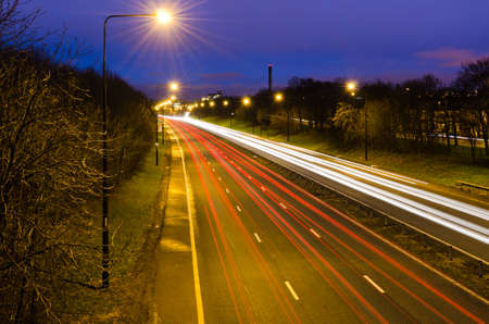 Traffic light trails entering Newcastle at duskの写真素材