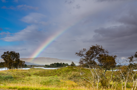 Rainbow over Rannoch Moor and Loch Baの写真素材
