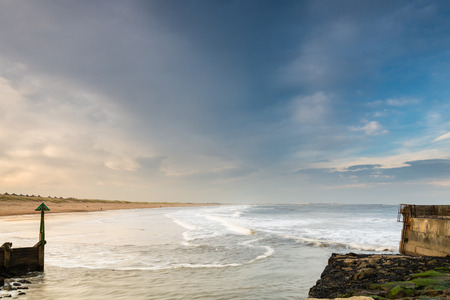 Seaton Sluice Harbour exit is natural formed by the Seaton Burn and is now mainly used by fishing boatsの写真素材