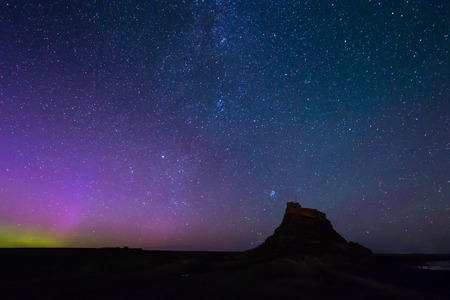Aurora Borealis over Lindisfarne Castle - The Aurora Borealis  and Milky Way above Lindisfarne Castle on Holy Island in Northumberlandのeditorial素材