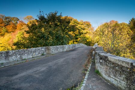 Twizel Bridge Roadway - Built in 1511 the medieval Twizel Bridge played a major part in the build up to the Battle of Flodden. It crosses the River Till in the border country of Northumberlandの写真素材