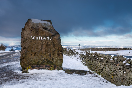 Scottish Border Marker Stone - Marker Stone showing entry to Scotland from England at the Carter Bar Viewpoint in winterの写真素材