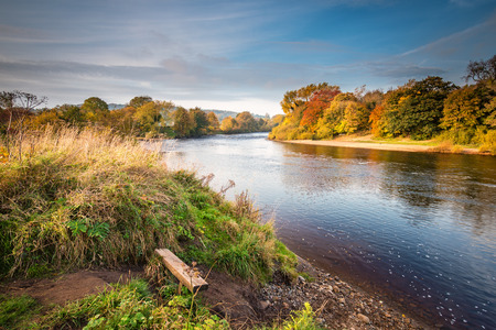 River Tyne formed from North and South Tynes, as they converge at the confluence, near Warden in Northumberland. Also known as, The Meeting of the Waters, seen here in autumnの写真素材