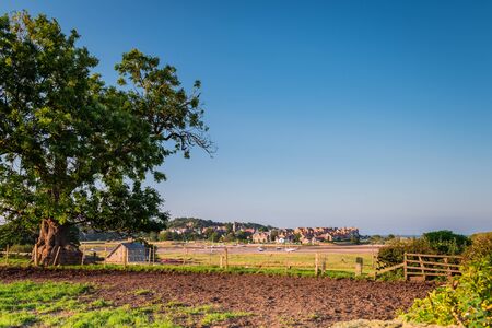 Alnmouth Village across Aln Estuary, is a picturesque village over the River Aln Estuary, as the river nears the North Seaの写真素材