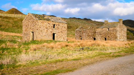 Derelict Buildings at Grove Rake Mine, the remains of the old lead mine are near Rookhope in Weardale, County Durham, the last remaining headgear in the North Pennines orefieldの写真素材