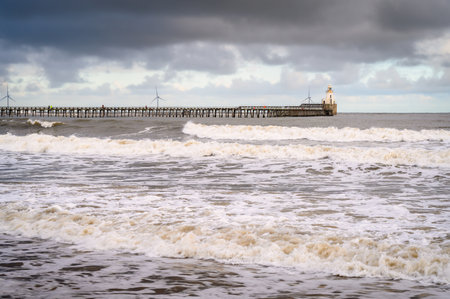 Waves on Blyth Beach south of the Harbour about 7 miles north of Tynemouth and has had a very commercial recent past. It sits on the east coast of Northumberland in Englandの写真素材