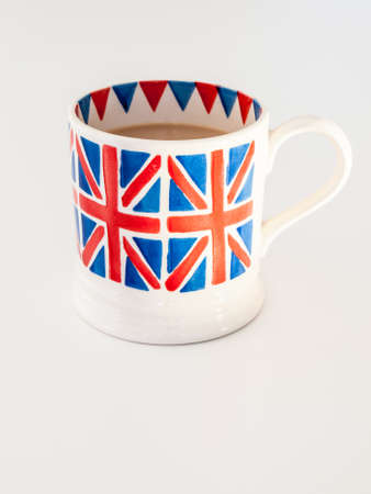 A cup of milky english tea in a british union jack mugの写真素材