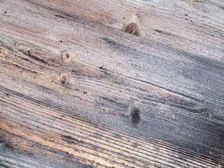 architectural detail of aged and weathered wooden planks running diagonallyの写真素材