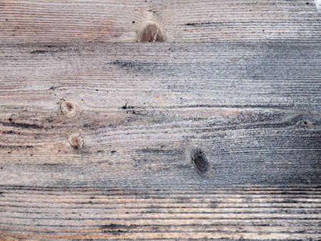 architectural detail of aged and weathered wooden planks running horizontallyの写真素材