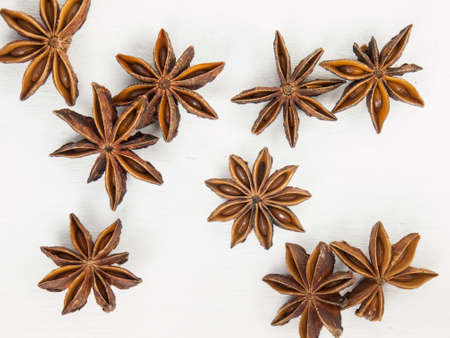 close up of  of star anise on a rustic white table topの写真素材