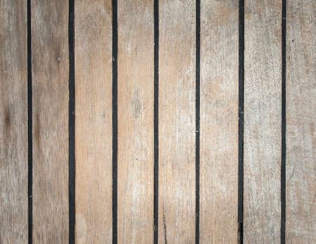 aged ships deck in teak with black caulkingの写真素材