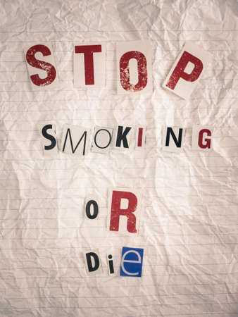 ransom note carrying the text stop smoking or die. health risk of smoking concept.の写真素材