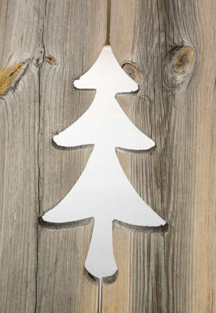 christmas tree motif in grey aged wooden shutterboard fenceの写真素材
