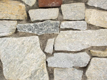 closeup detail of grey stone wall for backgroundの写真素材