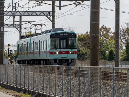 The local Nishitetsu commuter train moves through the countryside in Kurume on its way to Fukuoka...