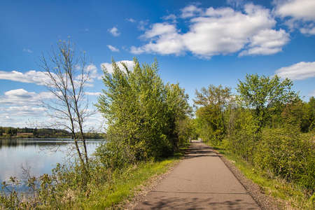 A blue sky with white clouds makes for a beautiful late Spring day along the Old Abe State Trail,...