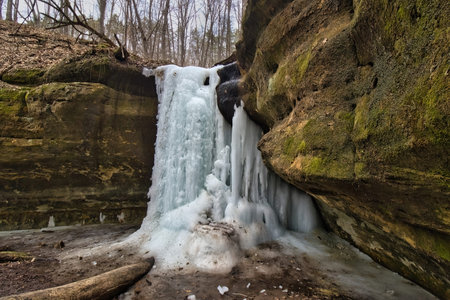 View of a frozen waterfall inside a sandstone gorge at Wildcat Mountain State Park near Ontario, Wisconsin.の写真素材