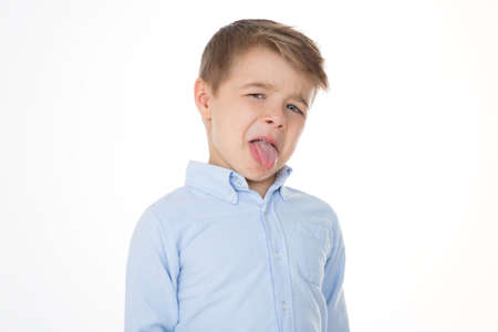 boy shows his tongueの写真素材
