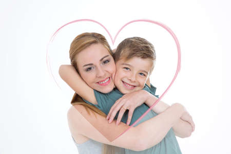 heart shape sorrounds brother and sister hugging