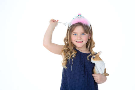 little girl plays with rabbit and scepterの写真素材