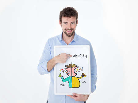 smiling guy teaching which foods are bad and which are healthyの写真素材