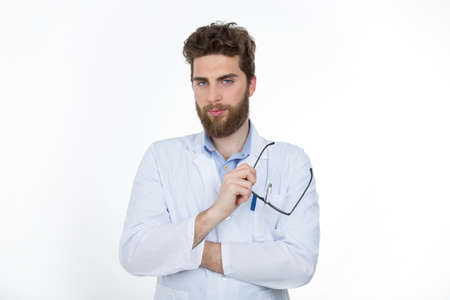 young doctor with a lab coat looking at cameraの写真素材