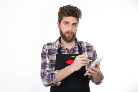 young worker writing on notes isolated on white background