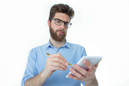 bearded boy makes a brainstorming in his studioの写真素材