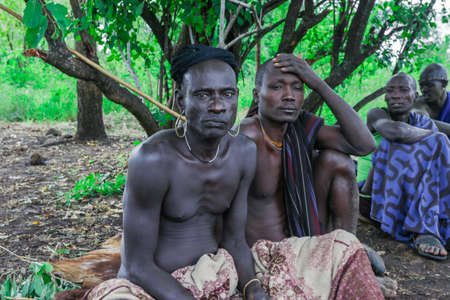 Omo River Valley, Ethiopia, November 2020, Men in traditional outfits from the Mursi tribeのeditorial素材