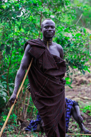 Omo River Valley, Ethiopia, November 2020, Men in traditional outfits from the Mursi tribeのeditorial素材