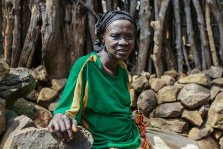 Konso, Ethiopia - November 30, 2020: African Konso Woman working hard in the Local Tribal  Villageのeditorial素材