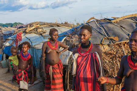 Omo River Valley, Ethiopian -November 30, 2020: Dassanech Tribe Woman with Traditional Bright Necklace in the Local Villageのeditorial素材