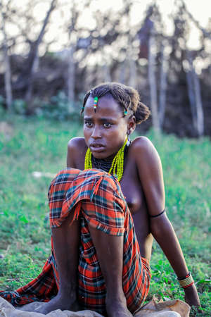 Omo River Valley, Ethiopian -November 30, 2020: Dassanech Tribe Woman with Traditional Bright Necklace in the Local Villageのeditorial素材