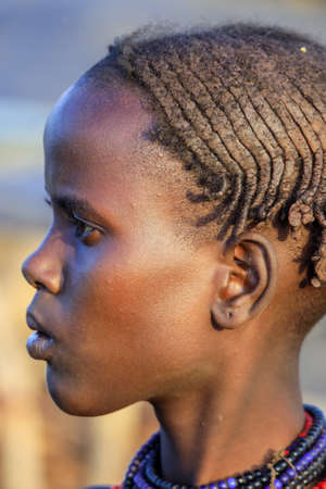 Omo River Valley, Ethiopian -November 30, 2020: Close up Portrait of Dassanech Tribe Woman with Traditional Bright Necklace and Hairstyleのeditorial素材