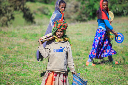 Gondar, Ethiopia - December 01, 2020: Local Sellers of Traditional and Bright African Souvenirs in Simien Mountainsのeditorial素材