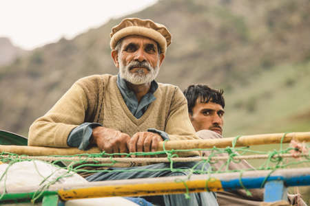 Gilgit, Pakistan - June 09, 2018: Old Pakistani Man with White Beard in Traditional Pakol