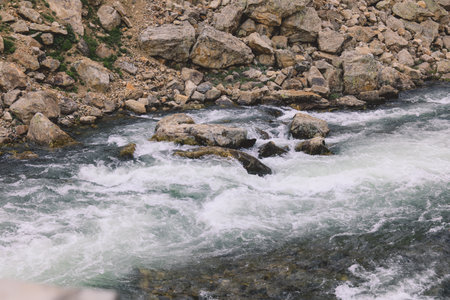 Mountain Rocks in the River Water Flow in Gilgit Baltistan Highlands, Pakistanの写真素材