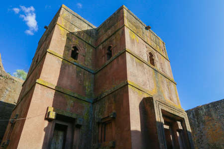 Main View to the Church of Saint George, one of many churches hewn into the rocky hills of Lalibela,...