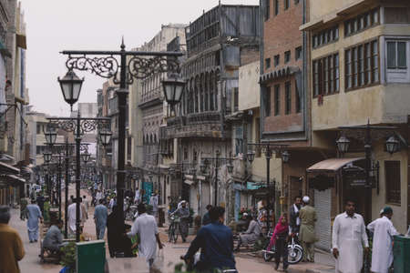 Peshawar, Pakistan - July 20, 2021: Daily life of the crowded Pakistan city center with the...