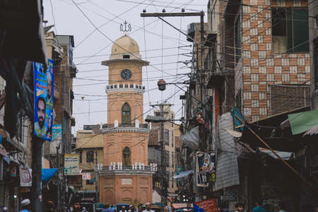 Peshawar, Pakistan - July 20, 2021: Daily life of the crowded Pakistan city center with the Buildings and Rickshawsのeditorial素材