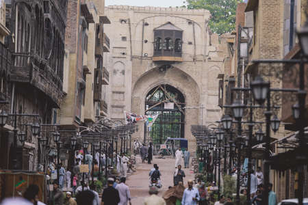 Peshawar, Pakistan - July 20, 2021: Daily life of the crowded Pakistan city center with the Buildings and Rickshawsのeditorial素材