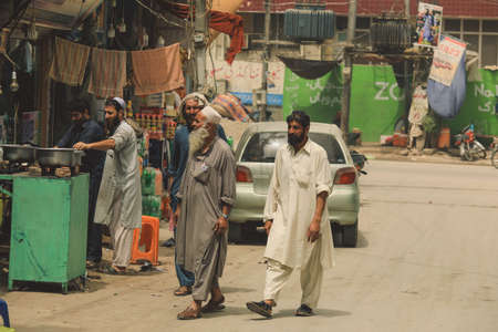 Peshawar, Pakistan - July 21, 2021: Local People on the Peshawar City Center Crowded Streetsのeditorial素材