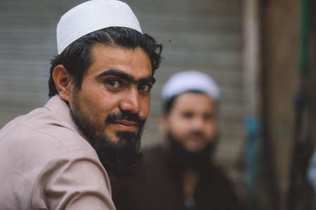 Peshawar, Pakistan - July 21, 2021: Local People on the Peshawar City Center Crowded Streets