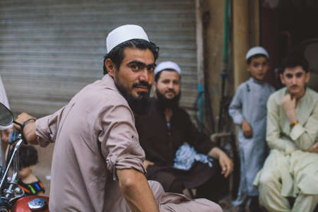 Peshawar, Pakistan - July 21, 2021: Local People on the Peshawar City Center Crowded Streetsのeditorial素材