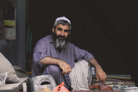 Peshawar, Pakistan - July 21, 2021: Portrait of the Smiling Pakistan Seller Man in the Peshawar City Central Marketのeditorial素材