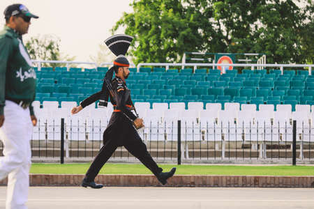Wagah Border, Pakistan - July 22, 2021: Pakistan Soldiers in Bright Military Uniform on the Wagah Attari Border Showのeditorial素材