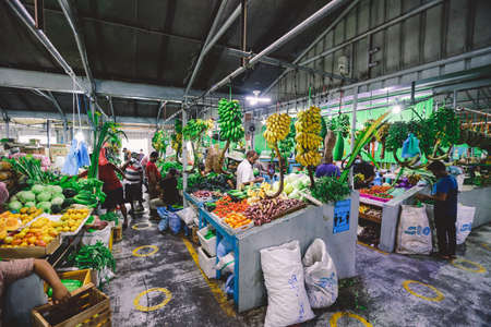 Male, Maldives - June 25, 2021: Local People buying Fresh and Colorful Fruits and Vegetables on the Maldivian Market in Male Cityのeditorial素材