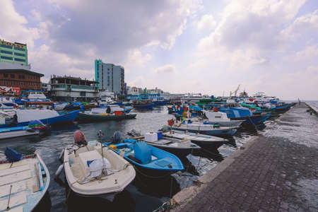 Male, Maldives - June 25, 2021: Colorful Boats and Ships in the Maldivian Blue Water Marina of the Male Cityのeditorial素材